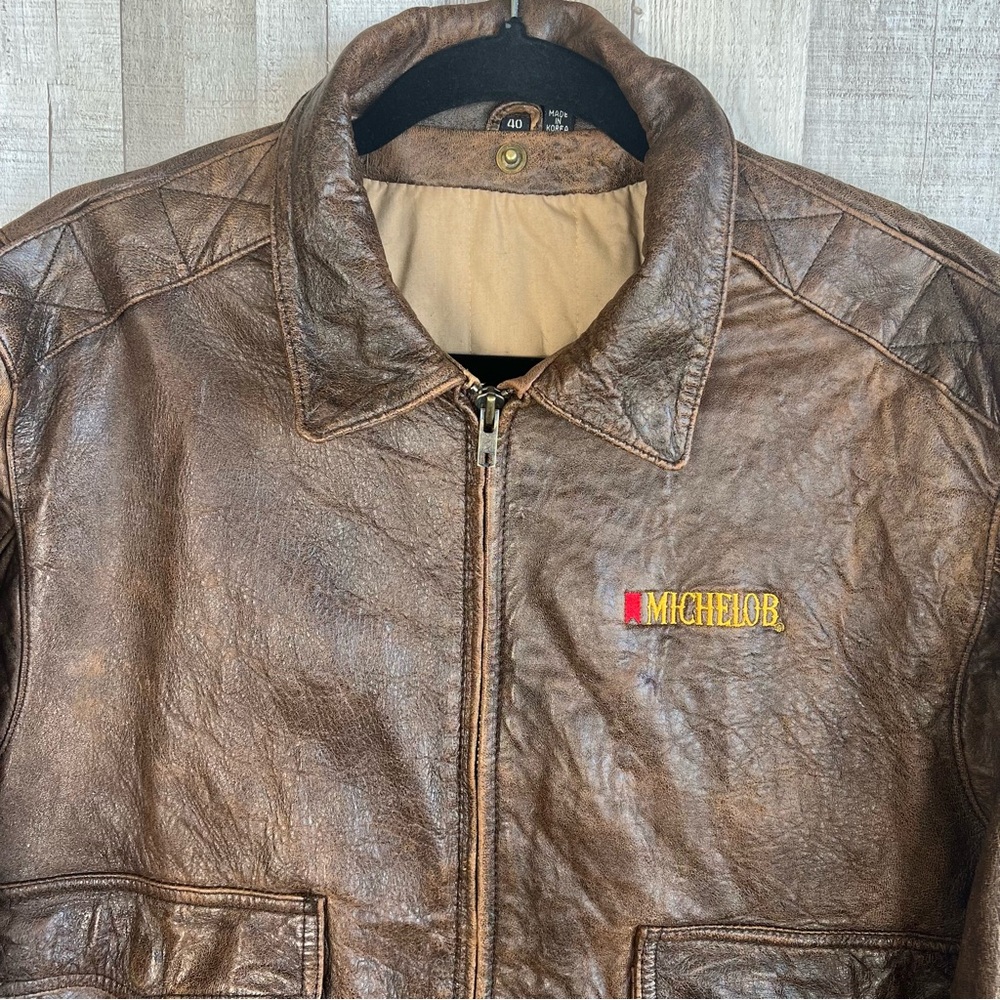 Vintage LeatherTown Bomber Aviator
Leather Jacket Size 40 Embroidered
Michelob - Picture 2 of 16